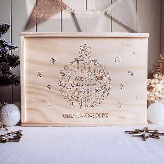 Wooden Christmas Eve box with festive design and text on a decorative background