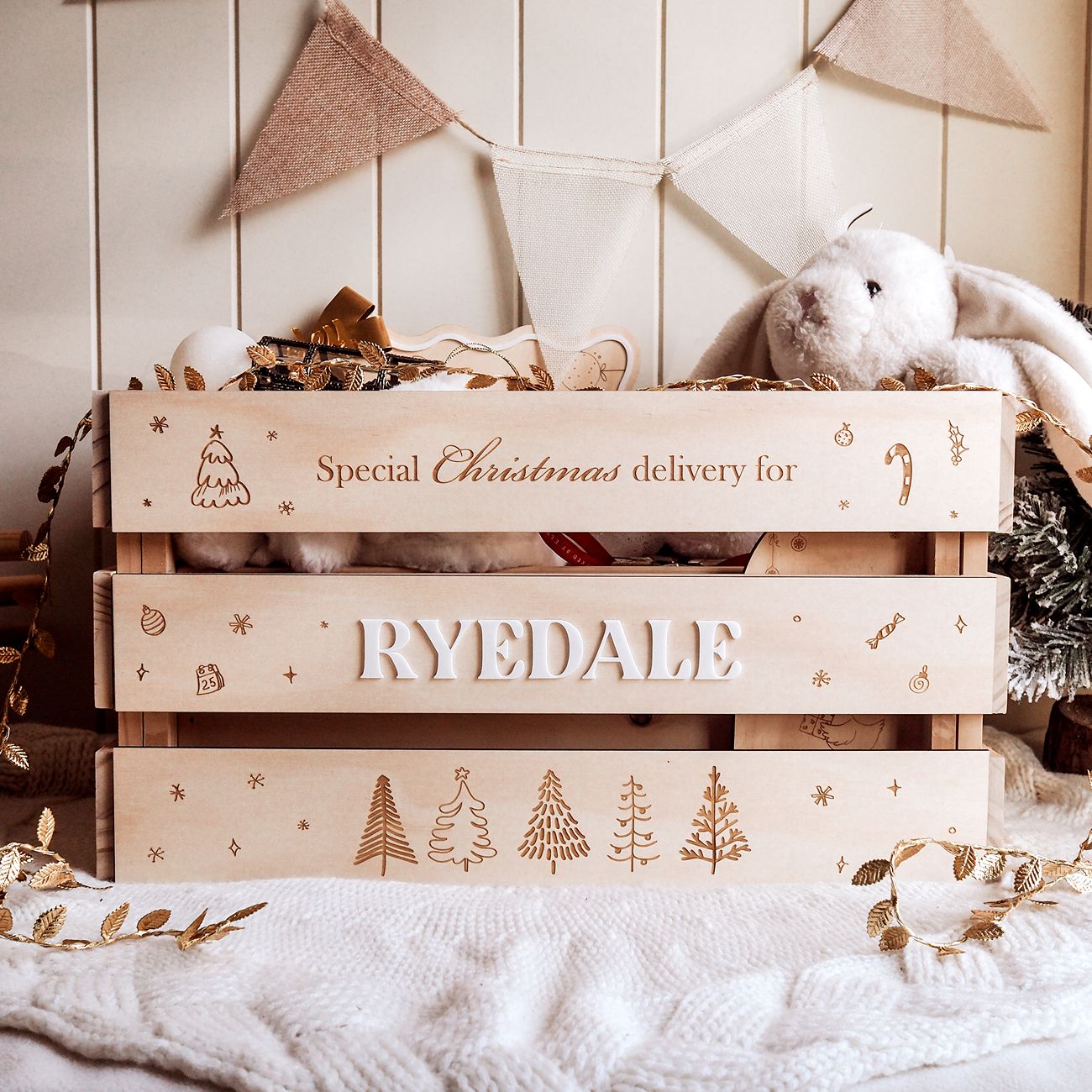 Wooden crate labeled 'Special Christmas delivery for Ryedale' with festive decorations.