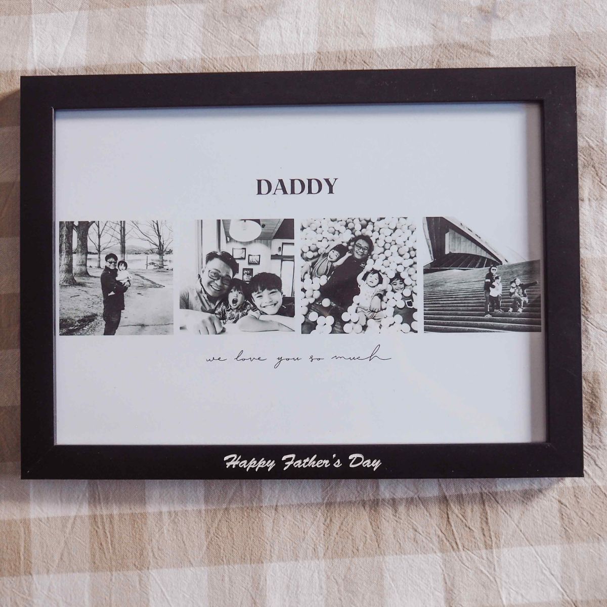 A 4 photo collage in landscape orientation with the writing of DADDY on top, then 4 photos and at the bottom of the picture is the phrase we love you so much. The frame is black with white print of "Happy Father's Day". Gingham background