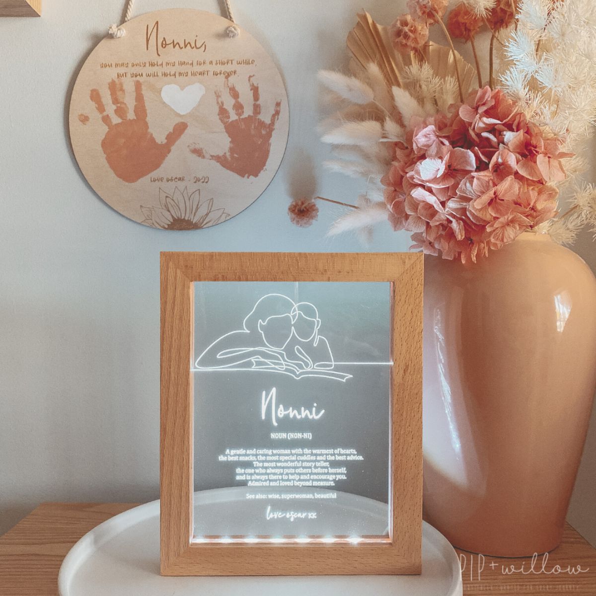 This is a Grandmother frame light normally given as a gift for Mother's day. The text on the frame is about a definition of a Grandmother. Photo is on the table