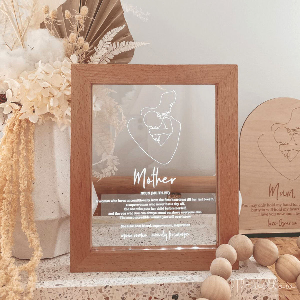 This is a Mother frame light normally given as a gift for Mother's day. The text on the frame is about a definition of a mother. Front view photo