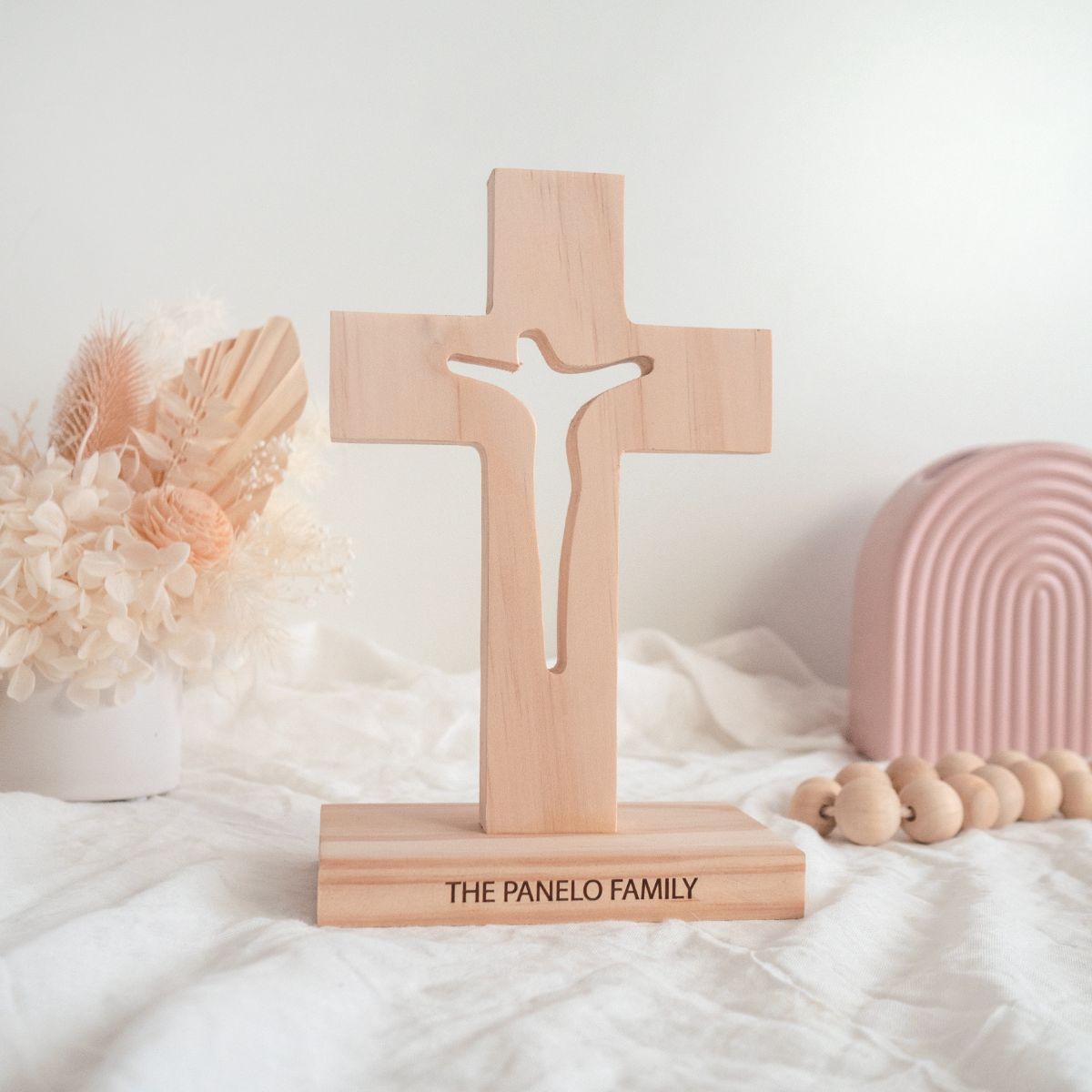 A personalised, Pine wood cross. Jesus on cross is cut through.
