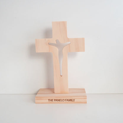 A personalised, Tasmanian oak wood cross. Jesus on cross is cut through. Clean background