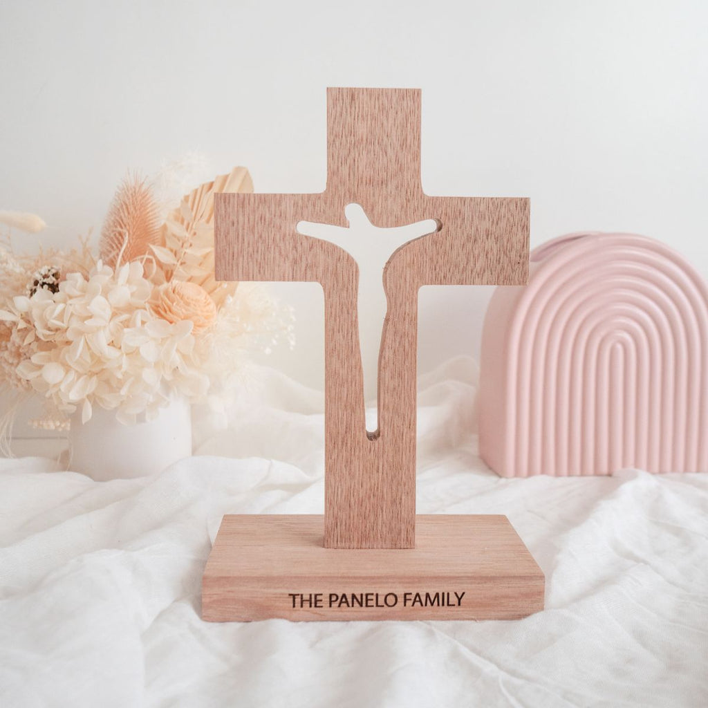 A personalised, Tasmanian oak wood cross. Jesus on cross is cut through.
