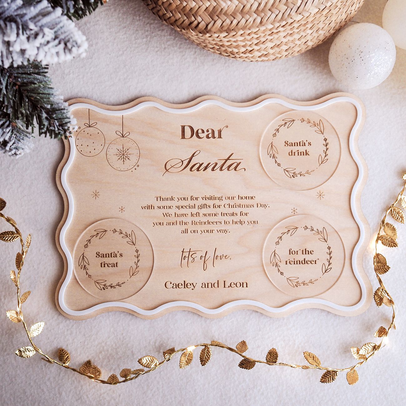 Personalized 'Dear Santa' letter with festive decorations on a light background