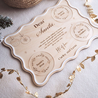 Personalized 'Dear Santa' letter on a decorative card with gold leaf accents.