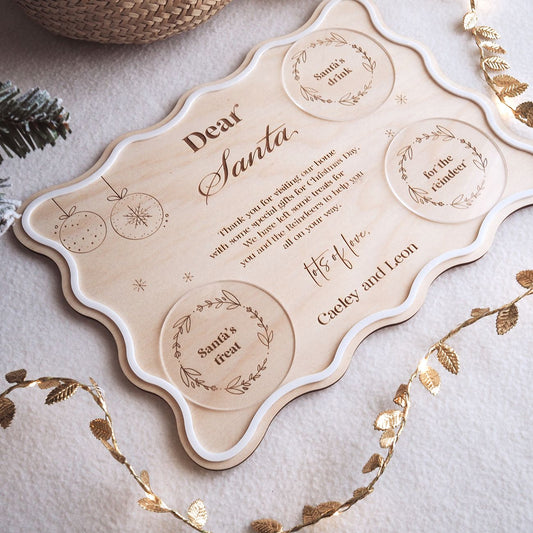 Personalized 'Dear Santa' letter on a decorative card with gold leaf accents.