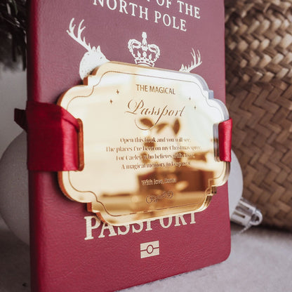 Red book with gold cover labeled 'The Magical Passport' on a textured surface.